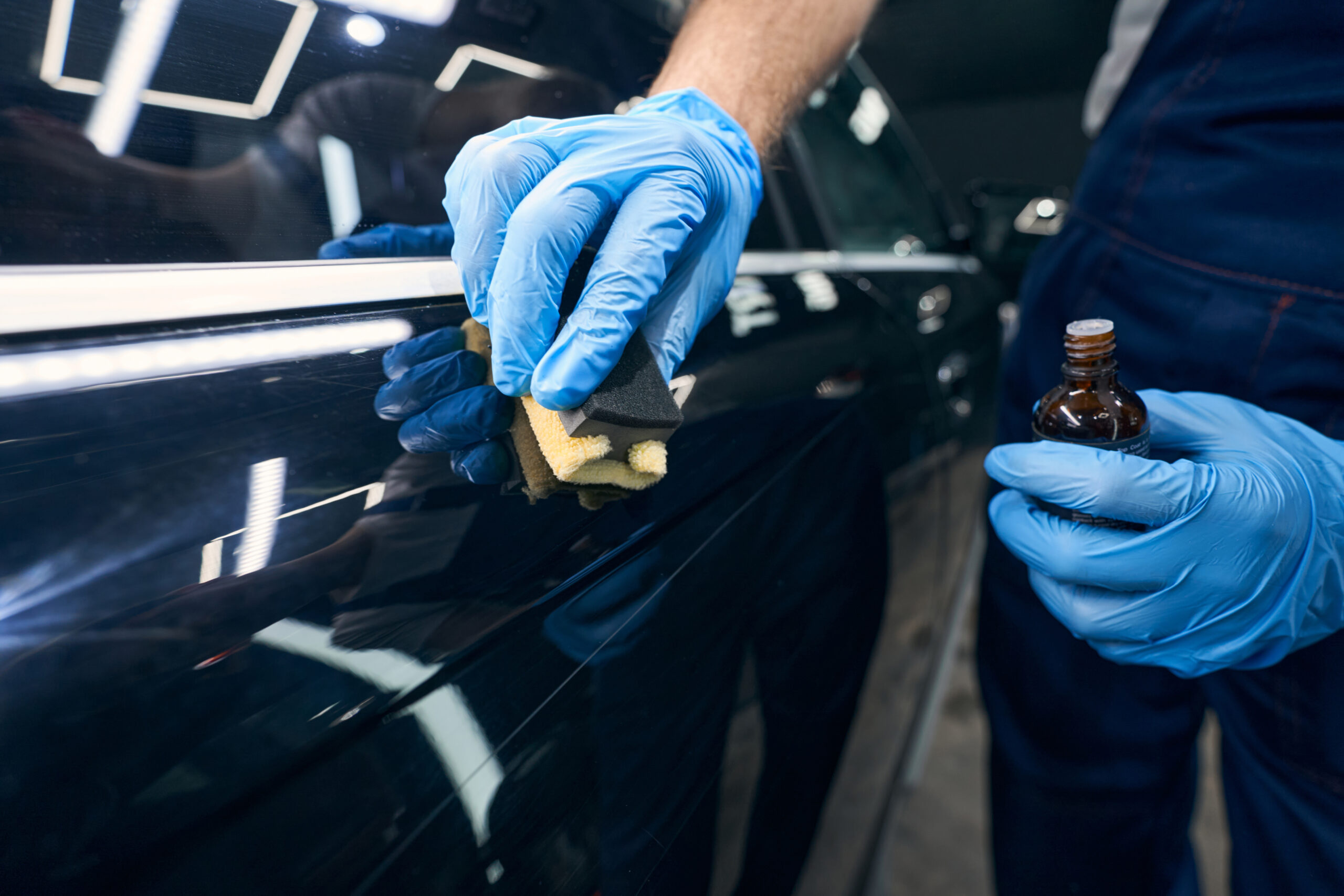 Technician applying ceramic coating