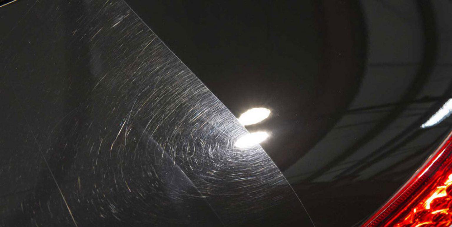 Swirl marks visible on black paint