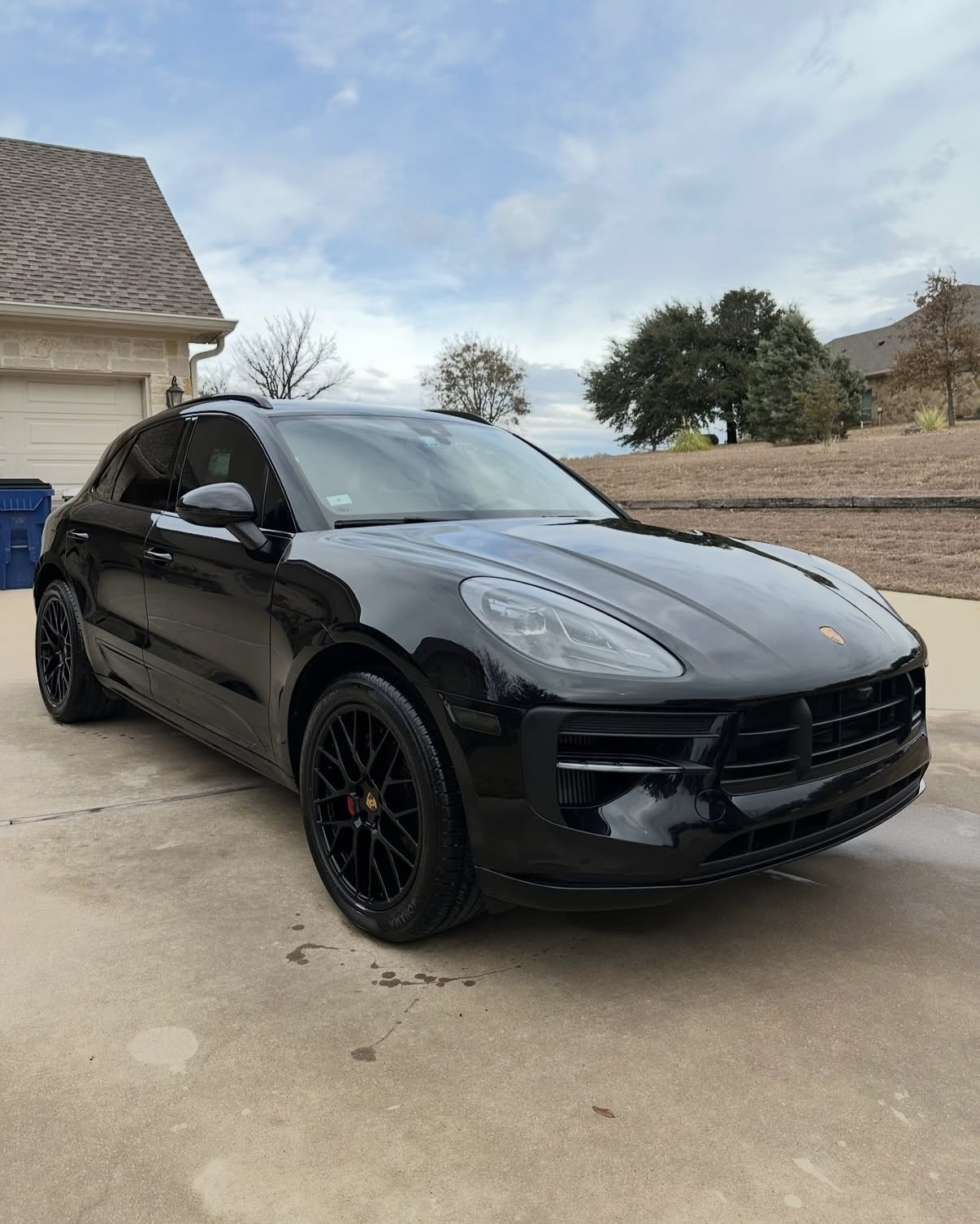 Black Porsche Macan gleaming after a first class detail