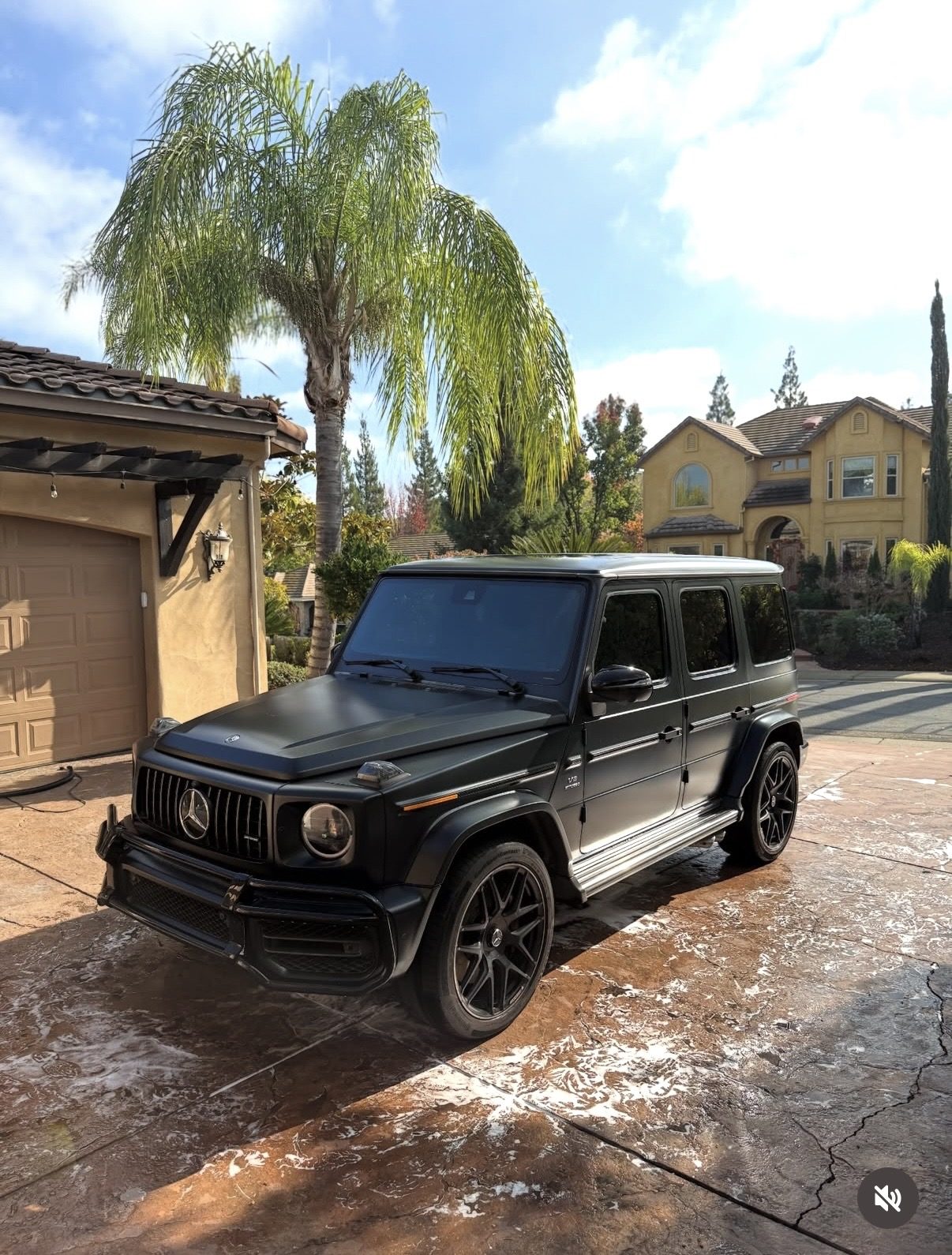 Black Mercedes-AMG G-Class gleaming after a full detail in an Orange County driveway